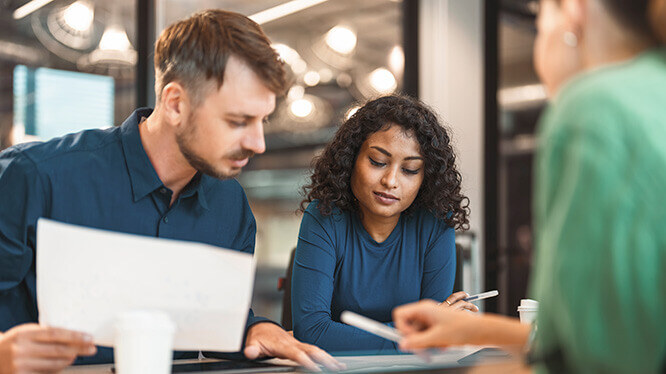 three colleagues working together